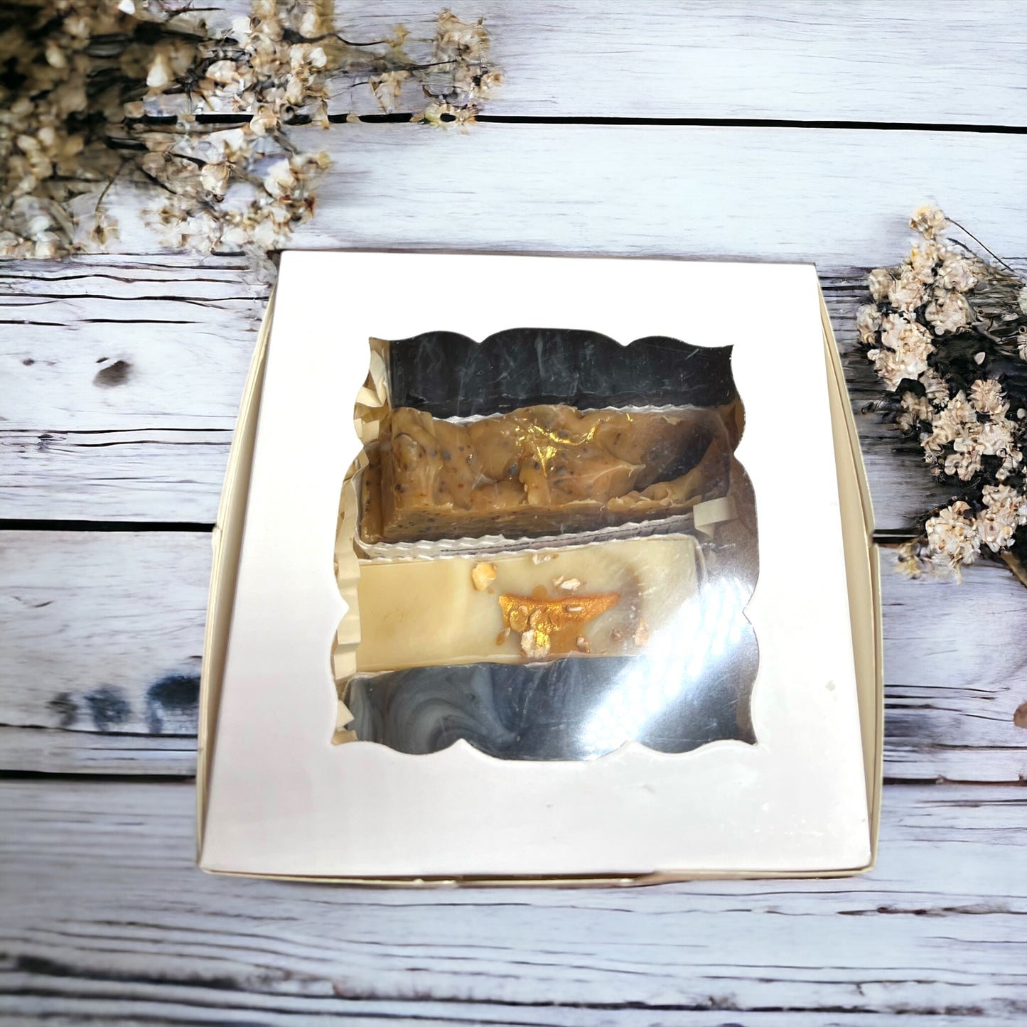 Soap bar gift box with four small soaps wrapped in seed paper