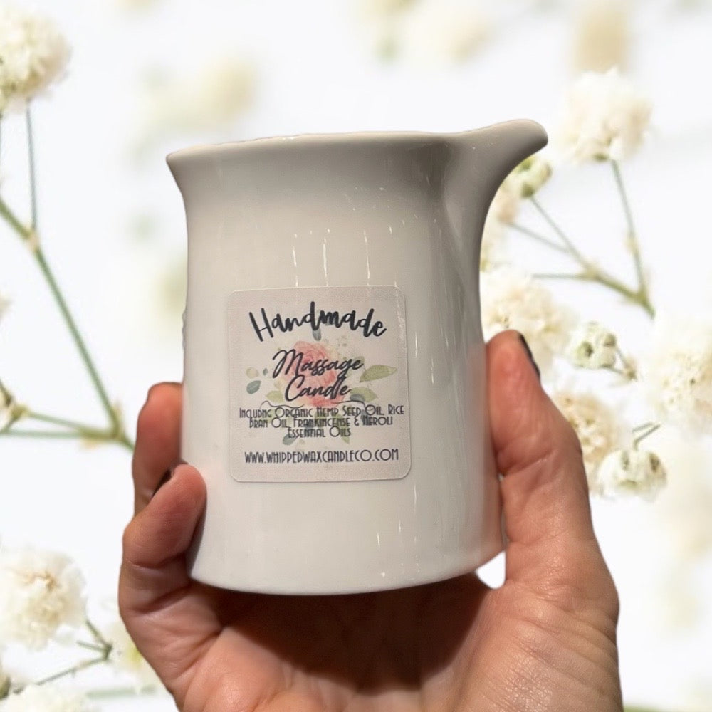 white ceramic massage candle with organic hemp seed oil and essential oils buddha and bubbles