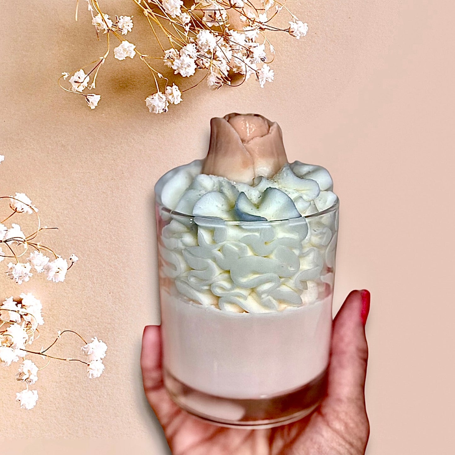 featuring a luxury whipped wax dessert candle Lily Berries with rose bud on a white table