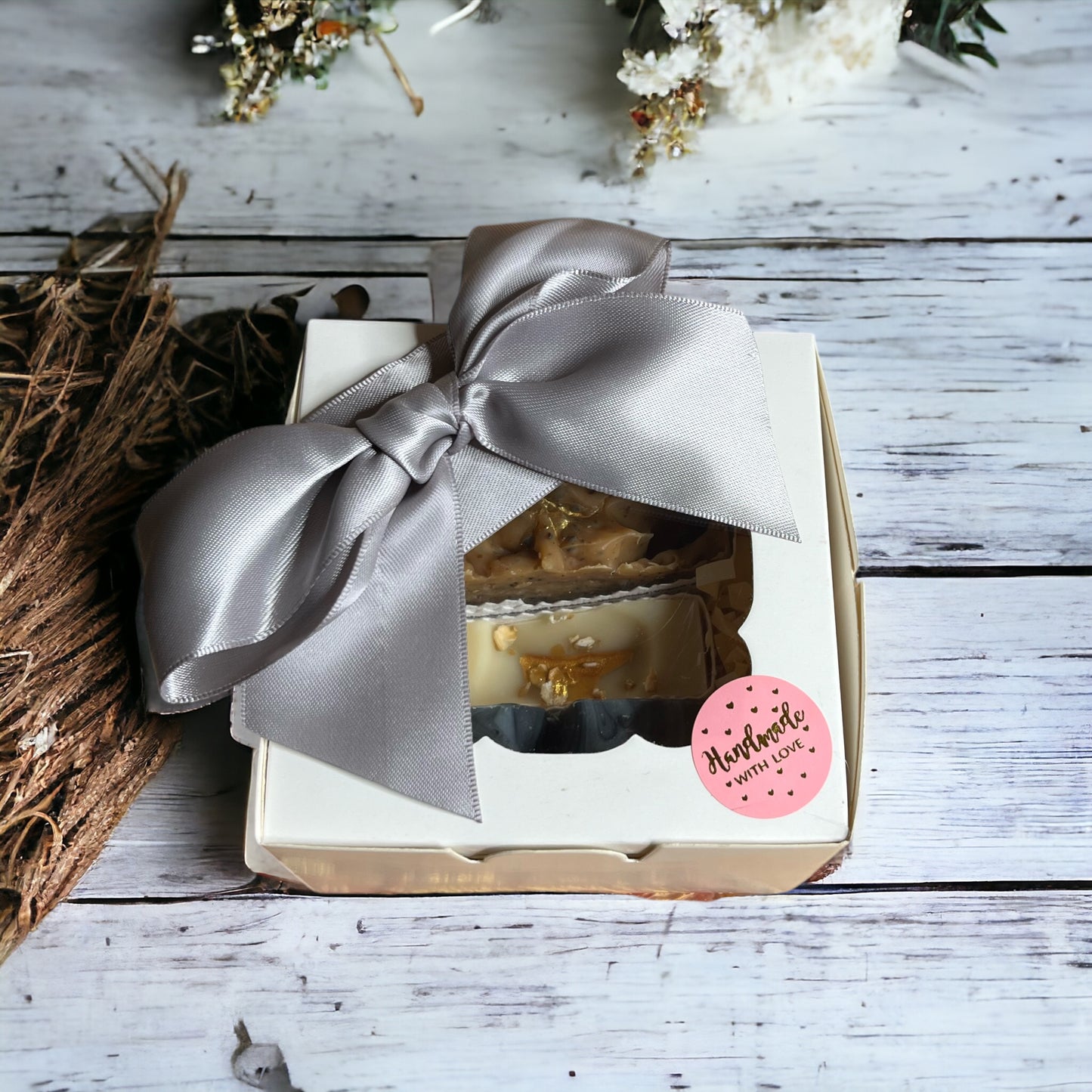 Soap bar gift box with four small soaps wrapped in seed paper