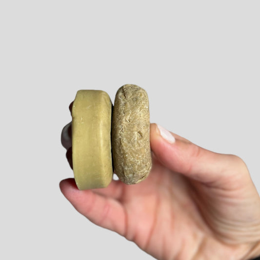 NURTURE solid shampoo and conditioner bars for dry damaged hair with natural ingredients with hand holding made by Buddha and Bubbles Botanicals