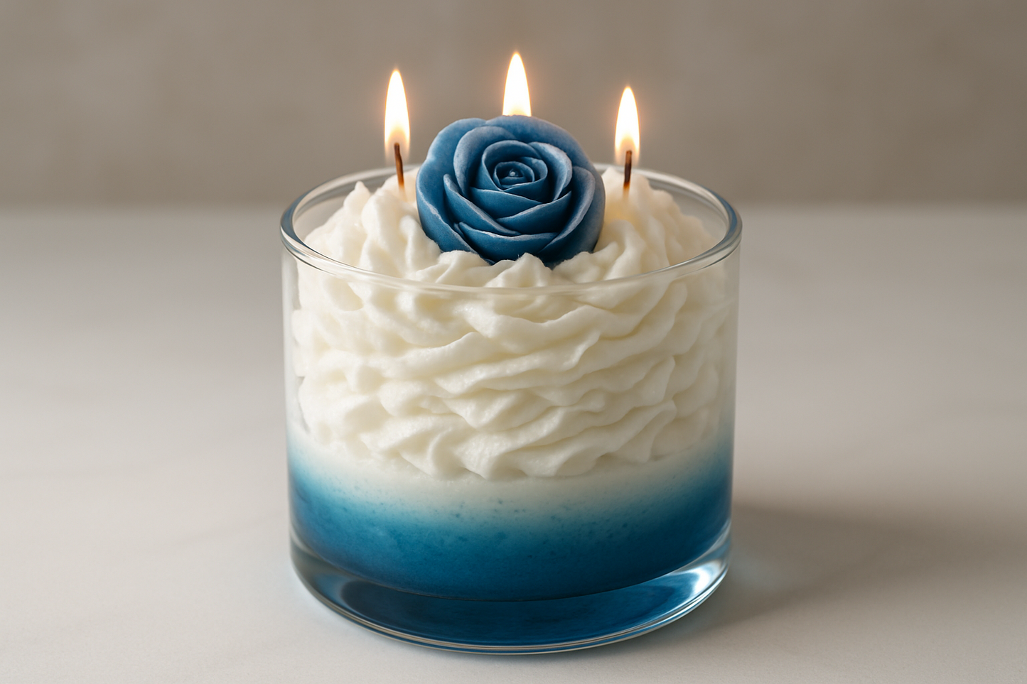 triple wicked whipped wax candle in glass jar with blue base and white whipped wax with a blue rose wax melt embed on top