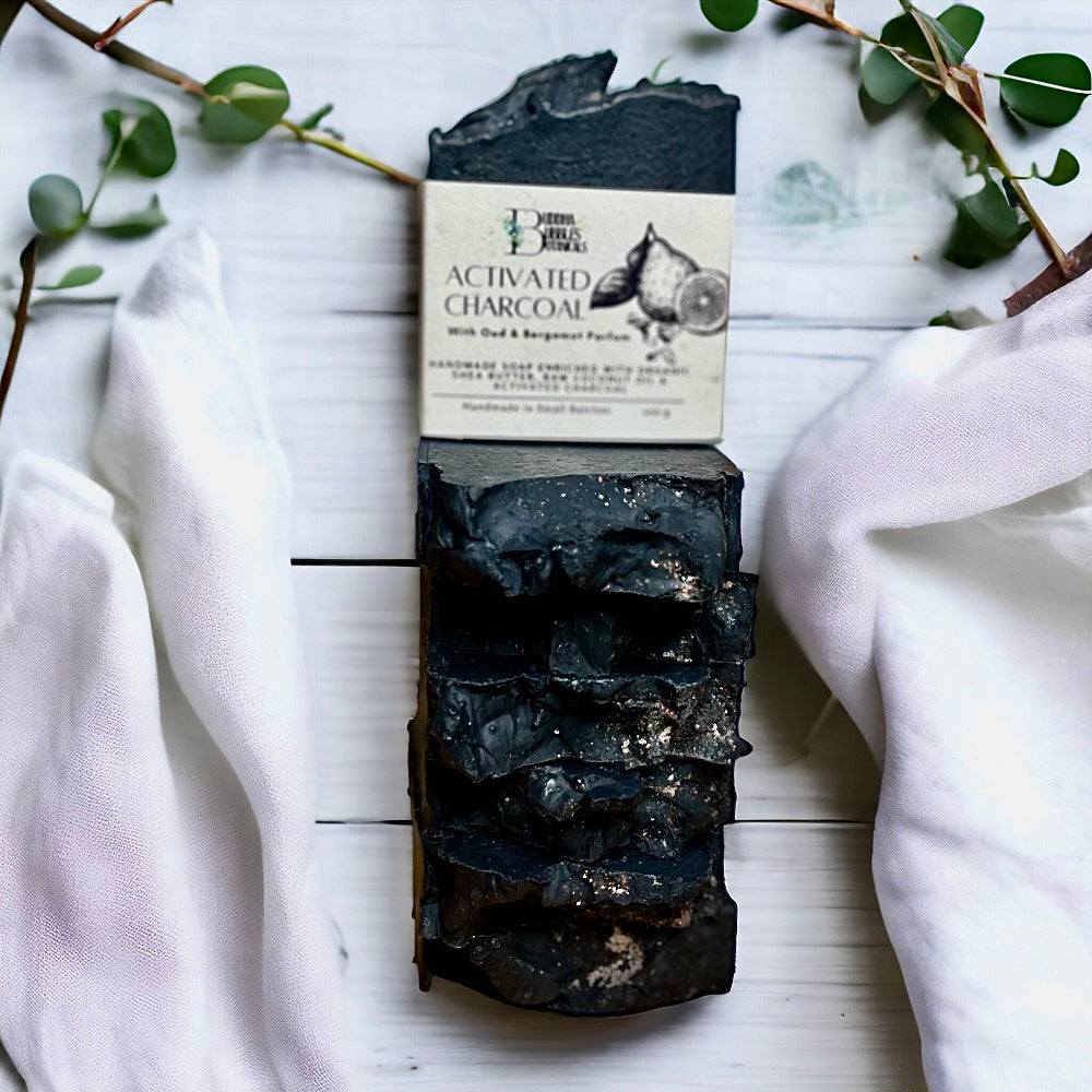 Soap bar exfoliating with activated charcoal, oud and bergamot parfum 