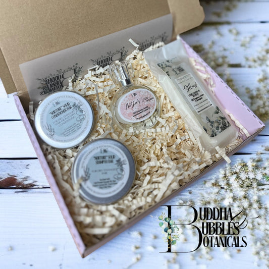 Xmas Gift set with shampoo and conditioner bar, perfume, essential oil wax melt in a Buddha & Bubbles Botanicals gold foiled gift box