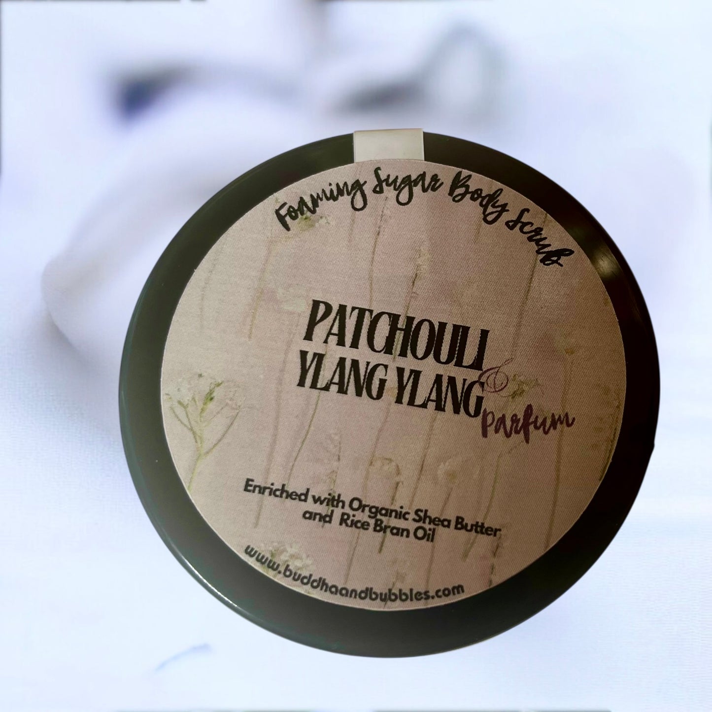 Patchouli Ylang Ylang body scrub container with branding
