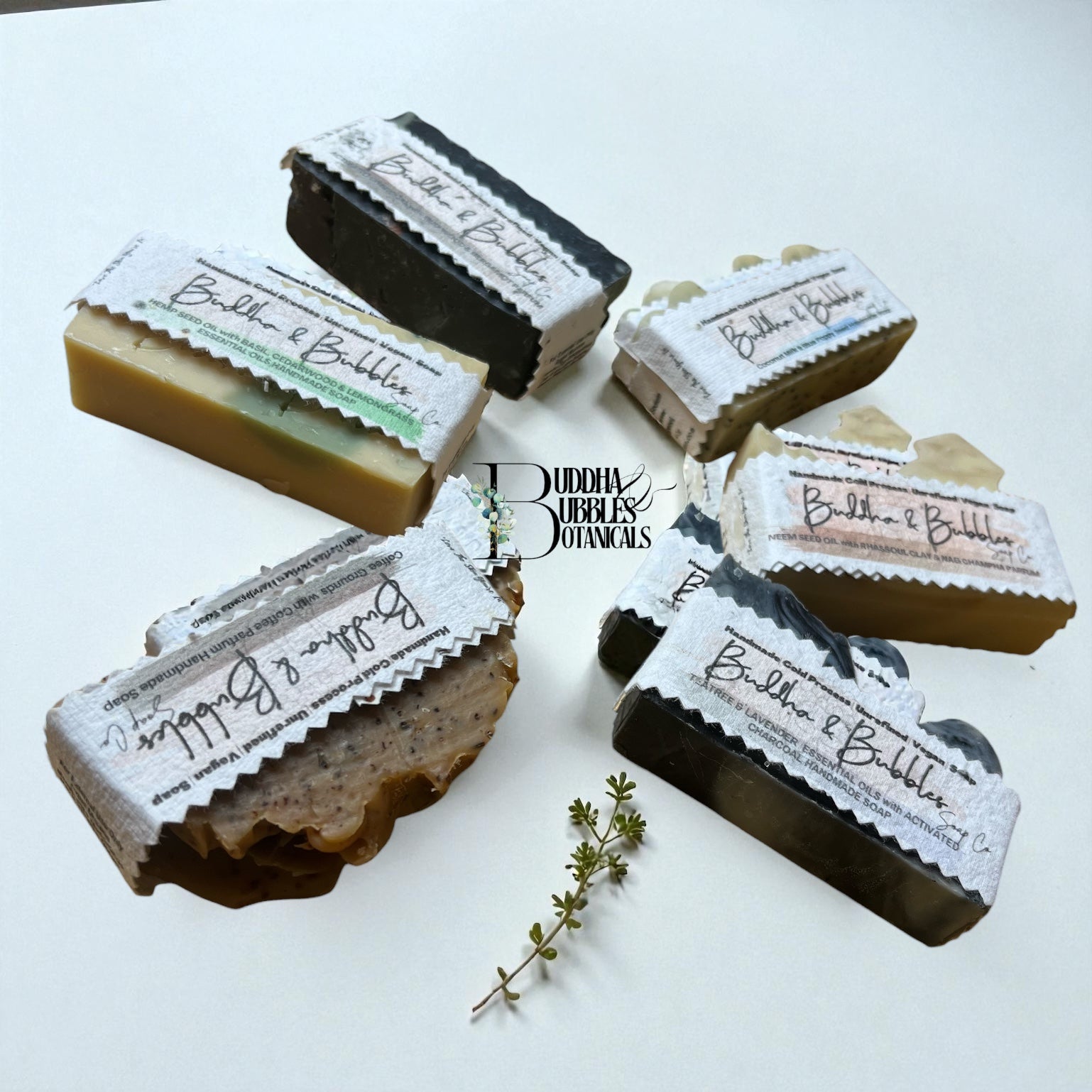 Bar soaps with labels on a white background made by buddha and bubbles botanicals