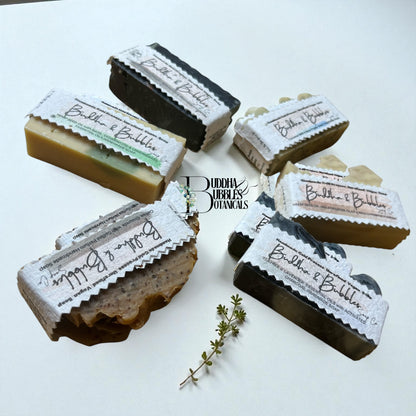 Bar soaps with labels on a white background made by buddha and bubbles botanicals