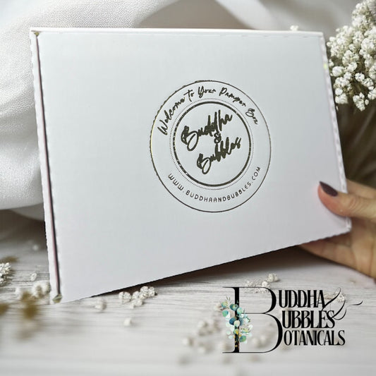 Pink box with 'Buddha & Bubbles' branding on a light background