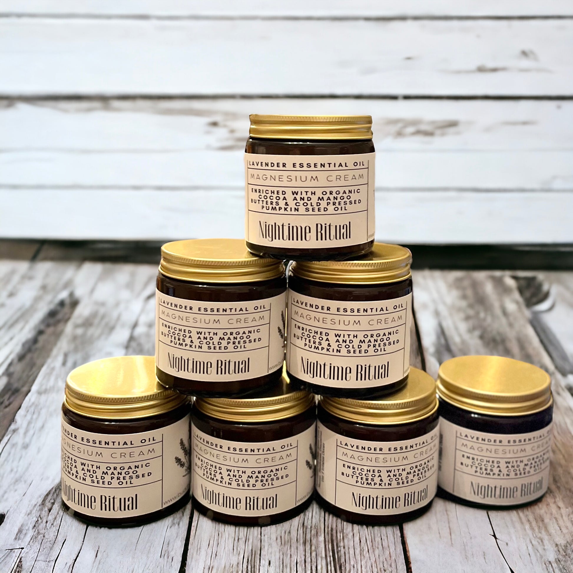 Nighttime Ritual cream designed for relaxation, muscle recovery, and deep hydration. Perfect for soothing nighttime routines and promoting restful sleep. Eco-friendly, natural skincare product displayed with delicate white flowers in background
