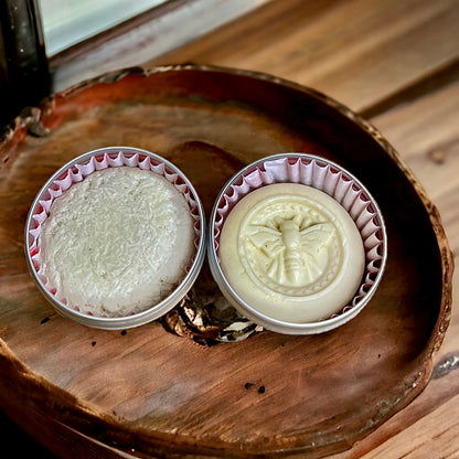 NAKED Solid shampoo and Conditioner bar sitting in a wooden shelf - Buddha and Bubbles Botanicals