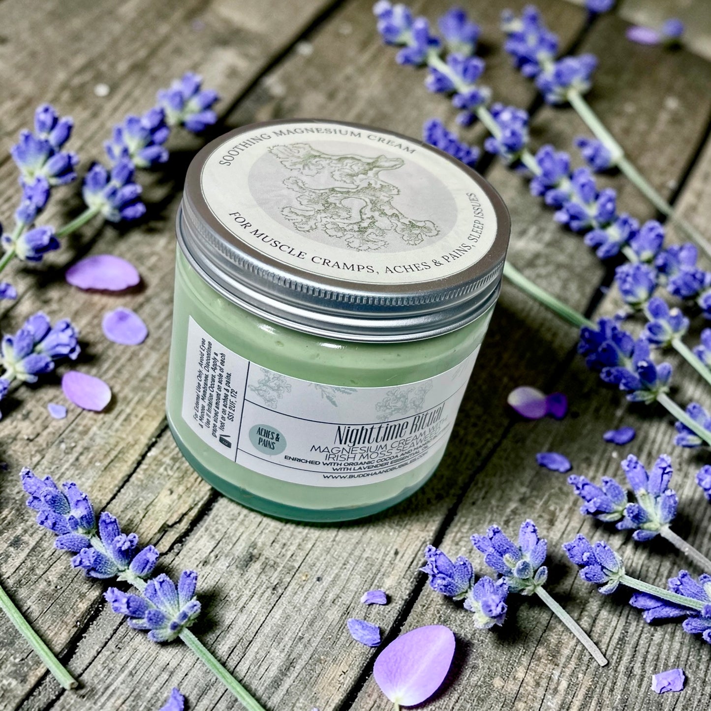 jumbo Jar of magnesium cream with lavender flowers on a wooden surface
