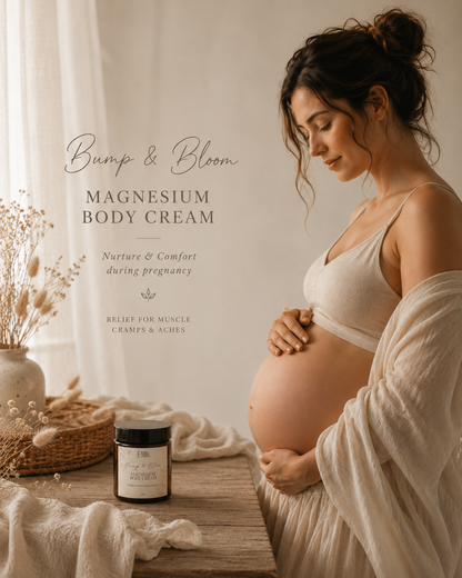 Pregnant woman holding her belly with a jar of 'Bump & Bloom Magnesium Body Cream' on a wooden table.